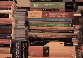 Multiple stacks of non-fiction books