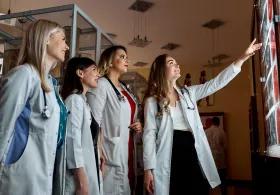 Group of medical professionals discussing medical scans