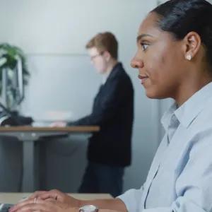 Support team typing at computers