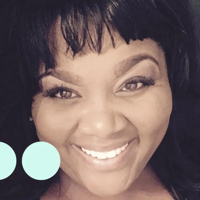 Black woman taking selfie, smiling for photo