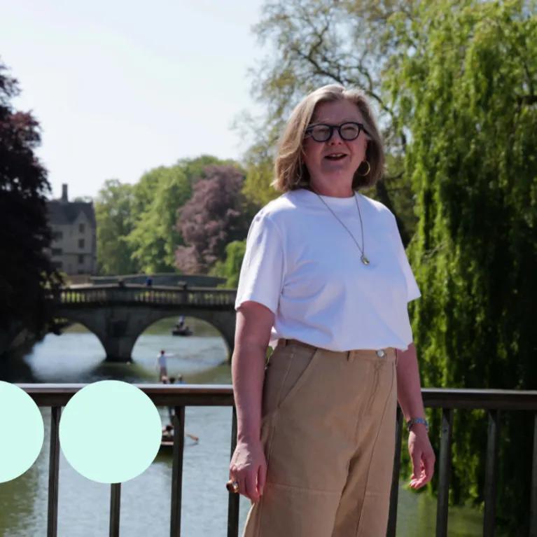 Woman stood on Cambridge bridge