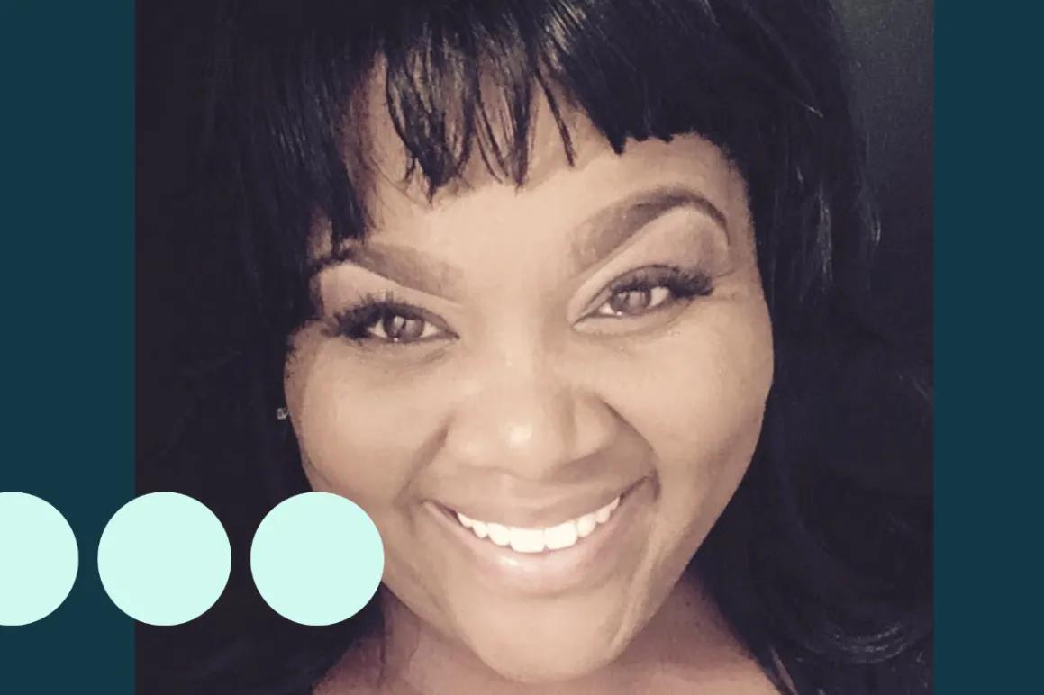 Black woman taking selfie, smiling for photo 